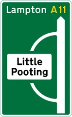 Junction ahead of a primary route with non-primary route through a town or village that has been by-passed — UK road sign