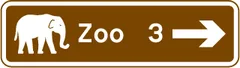 Junction ahead leading to a tourist attraction — UK road sign