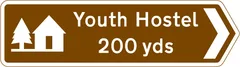 Youth hostel 200 yards in the direction indicated — UK road sign
