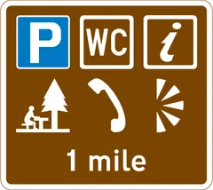 Distance ahead to parking place with a Tourist Information Point, picnic site, public telephone, public toilets and viewpoint — UK road sign