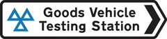 Direction to Vehicle and Operator Services Agency testing station for goods vehicles — UK road sign