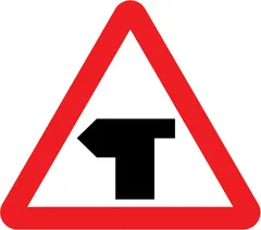 T-junction ahead (left) — UK road sign