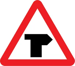 T-junction ahead (right) — UK road sign