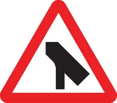 Traffic merges ahead onto main carriageway from the left — UK road sign