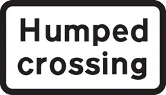 Crossing on road hump ahead — UK road sign