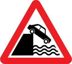 Quayside or river bank ahead — UK road sign