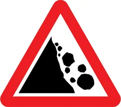 Risk of falling or fallen rocks ahead — UK road sign